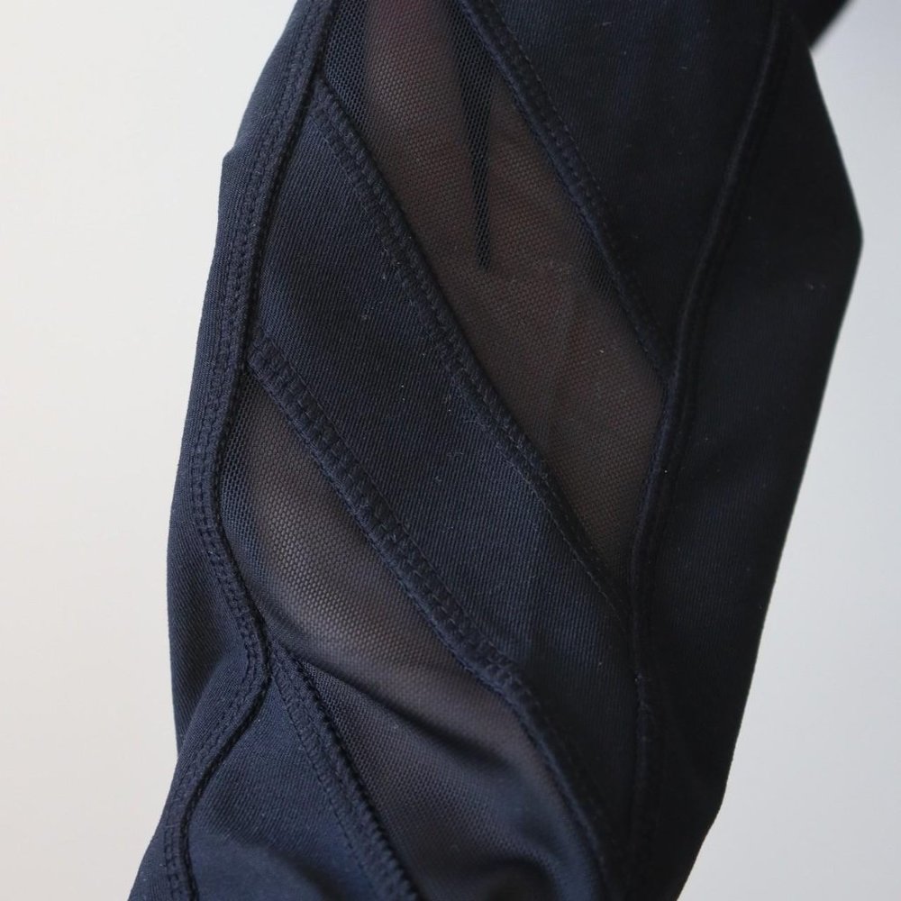 Mondetta black athletic leggings with mesh cutouts